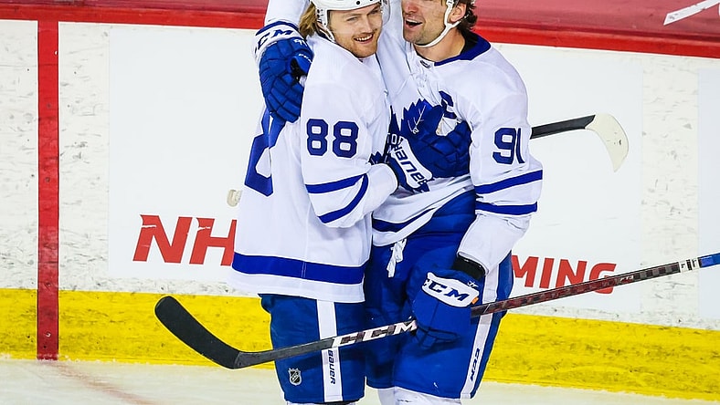 Apr 4, 2021; Calgary, Alberta, CAN; Toronto Maple Leafs center John Tavares (91) celebrates his goal with center William Nylander (88) during the third period against the Calgary Flames at Scotiabank Saddledome. Mandatory Credit: Sergei Belski-USA TODAY Sports
