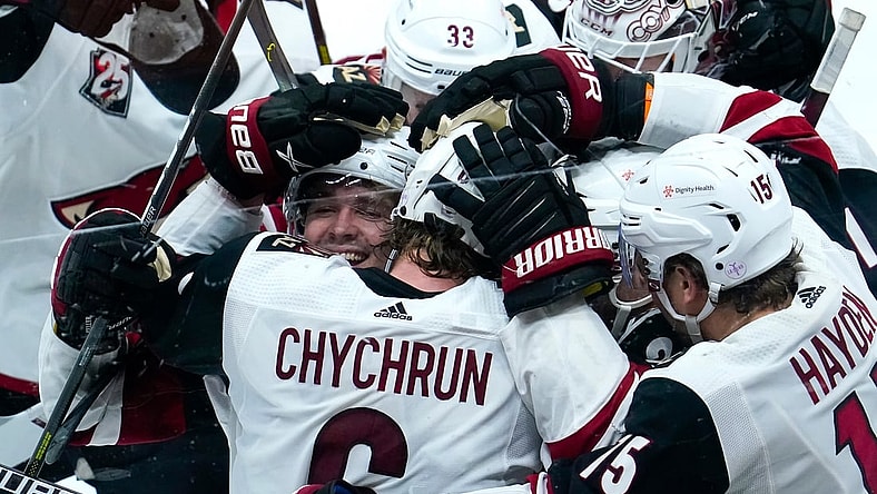 Apr 4, 2021; Anaheim, California, USA; Arizona Coyotes defenseman Jakob Chychrun (6) is mobbed by teammates after scoring the winning goal in overtime to beat the Anaheim Ducks 3-2 at Honda Center. It was Chychrun's third goal of the game. Mandatory Credit: Robert Hanashiro-USA TODAY Sports