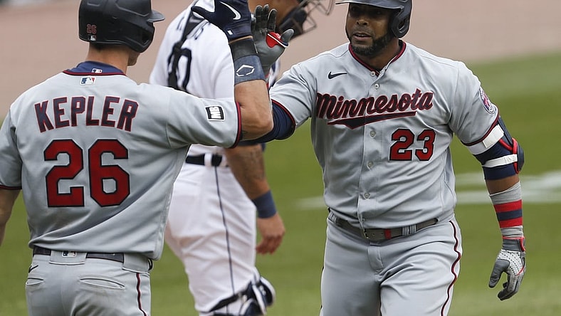 Apr 5, 2021; Detroit, Michigan, USA; Minnesota Twins designated hitter Nelson Cruz (23) celebrates with right fielder Max Kepler (26) after hitting a solo home run during the fifth inning against the Detroit Tigers at Comerica Park. Mandatory Credit: Raj Mehta-USA TODAY Sports