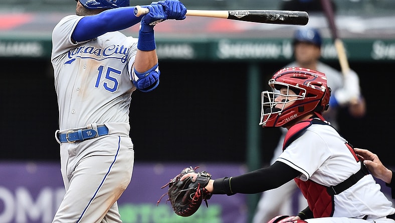 Apr 5, 2021; Cleveland, Ohio, USA; Kansas City Royals second baseman Whit Merrifield (15) hits a sacrifice fly during the seventh inning against the Cleveland Indians at Progressive Field. Mandatory Credit: Ken Blaze-USA TODAY Sports
