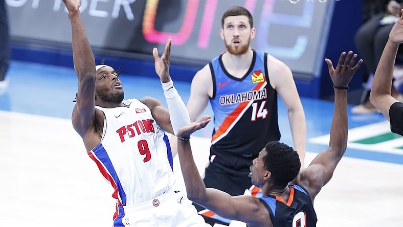 Apr 5, 2021; Oklahoma City, Oklahoma, USA; Detroit Pistons forward Jerami Grant (9) goes to the basket as Oklahoma City Thunder forward Jaylen Hoard (8) defends and guard Svi Mykhailiuk (14) looks on during the second half at Chesapeake Energy Arena. Mandatory Credit: Alonzo Adams-USA TODAY Sports