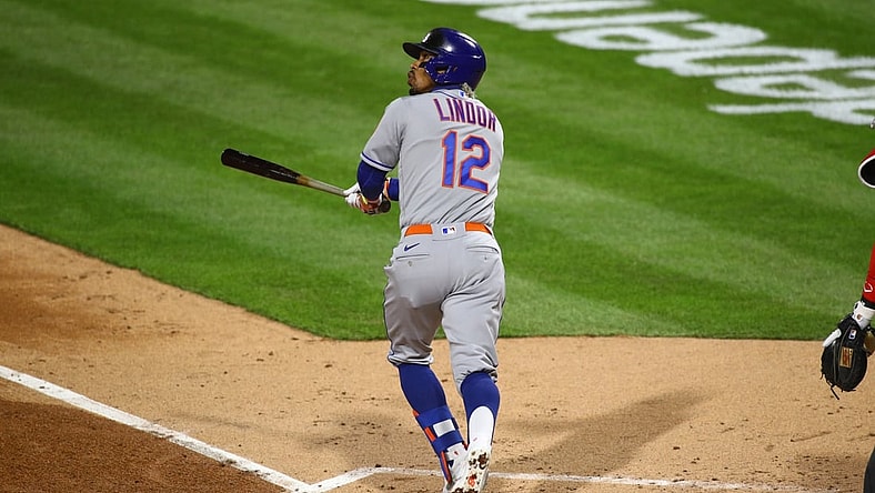 Apr 5, 2021; Philadelphia, Pennsylvania, USA; New York Mets shortstop Francisco Lindor (12) watches a fly ball in the third inning against the Philadelphia Phillies at Citizens Bank Park. Mandatory Credit: Kyle Ross-USA TODAY Sports