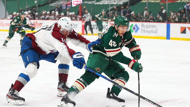 Apr 5, 2021; Saint Paul, Minnesota, USA; Colorado Avalanche right wing Valeri Nichushkin (13) and Minnesota Wild defenseman Jared Spurgeon (46) fight for the puck during the first period at Xcel Energy Center. Mandatory Credit: Harrison Barden-USA TODAY Sports