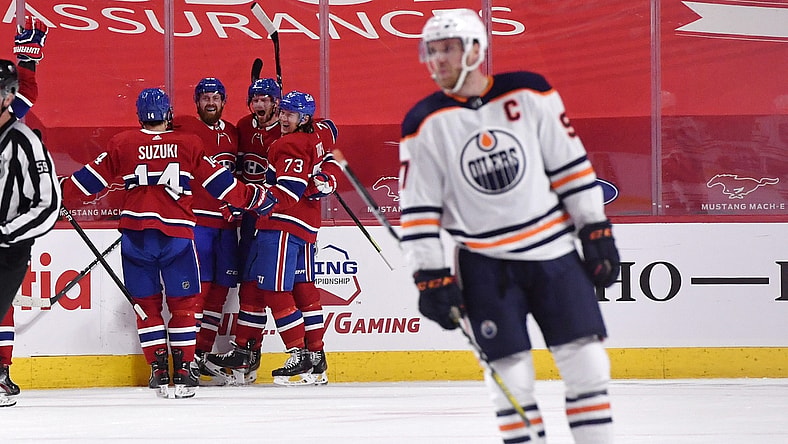 Apr 5, 2021; Montreal, Quebec, CAN; Montreal Canadiens forward Eric Staal (21) reacts with teammates including defenseman Jeff Petry (26) and forward Tyler Toffoli (73) and forward Nick Suzuki (14) after scoring the winning goal against the Edmonton Oilers during the overtime period at the Bell Centre. Mandatory Credit: Eric Bolte-USA TODAY Sports