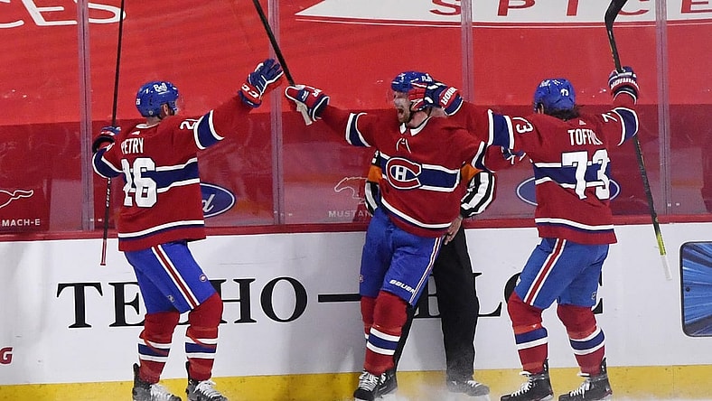Apr 5, 2021; Montreal, Quebec, CAN; Montreal Canadiens forward Eric Staal (21) reacts with teammates including defenseman Jeff Petry (26) and forward Tyler Toffoli (73) after scoring the winning goal against the Edmonton Oilers during the overtime period at the Bell Centre. Mandatory Credit: Eric Bolte-USA TODAY Sports