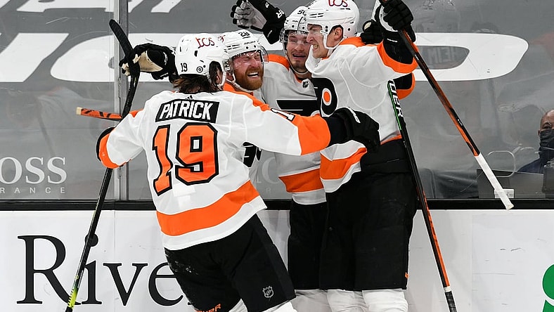 Apr 5, 2021; Boston, Massachusetts, USA; Philadelphia Flyers defenseman Travis Sanheim (6) celebrates with his teammates after scoring against the Boston Bruins during an overtime period at the TD Garden. Mandatory Credit: Brian Fluharty-USA TODAY Sports