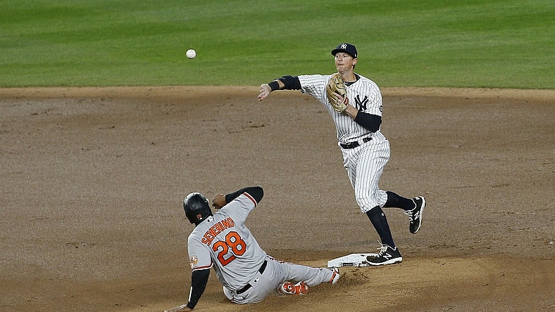 Apr 5, 2021; Bronx, New York, USA; Baltimore Orioles catcher Pedro Severino (28) is forced out at second base by New York Yankees second baseman DJ LeMahieu (right) during the fifth inning at Yankee Stadium. Mandatory Credit: Andy Marlin-USA TODAY Sports