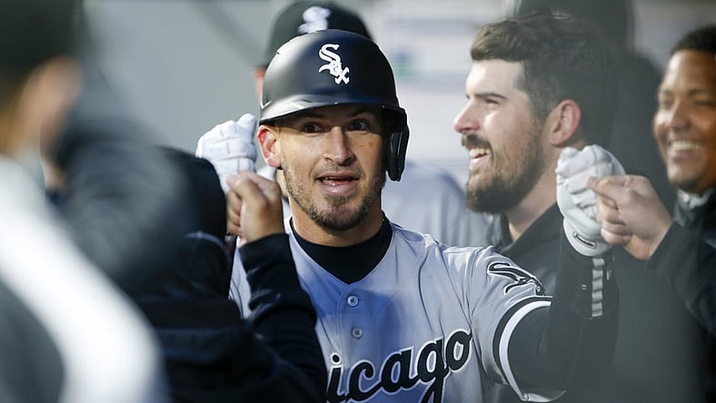 Apr 5, 2021; Seattle, Washington, USA; Chicago White Sox catcher Yasmani Grandal (24) celebrates in the dugout after hitting a solo home run against the Seattle Mariners during the second inning at T-Mobile Park. Mandatory Credit: Joe Nicholson-USA TODAY Sports