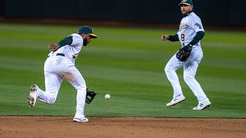Apr 5, 2021; Oakland, California, USA; Oakland Athletics shortstop Elvis Andrus (17) fields a ground ball against the Los Angeles Dodgers during the ninth inning at RingCentral Coliseum. Mandatory Credit: Neville E. Guard-USA TODAY Sports