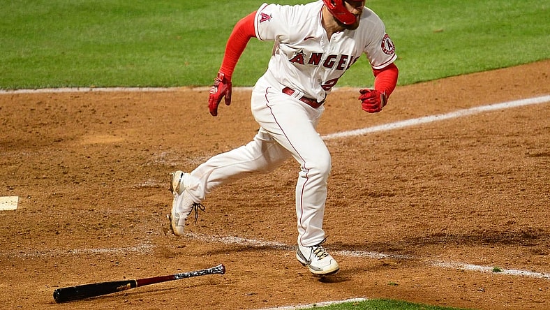 Apr 5, 2021; Anaheim, California, USA; Los Angeles Angels first baseman Jared Walsh (20) reaches first on a fielders choice against the Houston Astros during the eighth inning at Angel Stadium. Mandatory Credit: Gary A. Vasquez-USA TODAY Sports