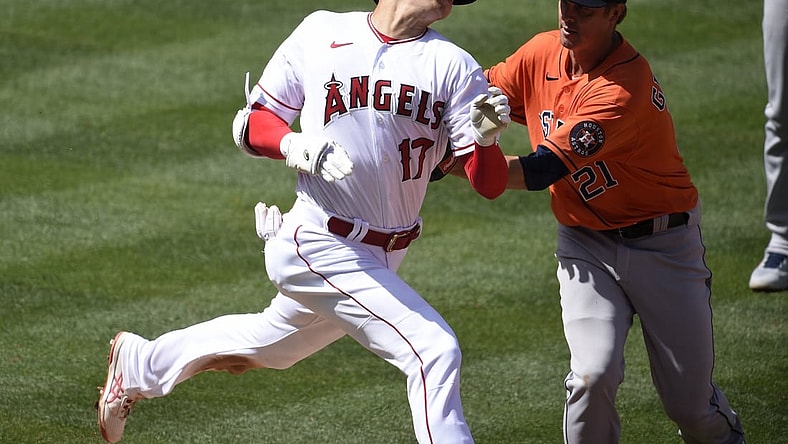 Apr 6, 2021; Anaheim, California, USA; Houston Astros starting pitcher Zack Greinke (21) tags out Los Angeles Angels designated hitter Shohei Ohtani (17) during the fifth inning at Angel Stadium. Mandatory Credit: Kelvin Kuo-USA TODAY Sports