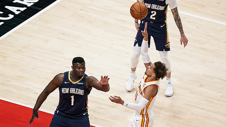 Apr 6, 2021; Atlanta, Georgia, USA; Atlanta Hawks guard Trae Young (11) shoots over New Orleans Pelicans forward Zion Williamson (1) during the first quarter at State Farm Arena. Mandatory Credit: Dale Zanine-USA TODAY Sports