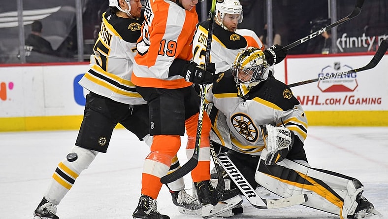 Apr 6, 2021; Philadelphia, Pennsylvania, USA; Boston Bruins defenseman Connor Clifton (75) holds back Philadelphia Flyers center Nolan Patrick (19) in front of  goaltender Jeremy Swayman (1) during the first period at Wells Fargo Center. Mandatory Credit: Eric Hartline-USA TODAY Sports