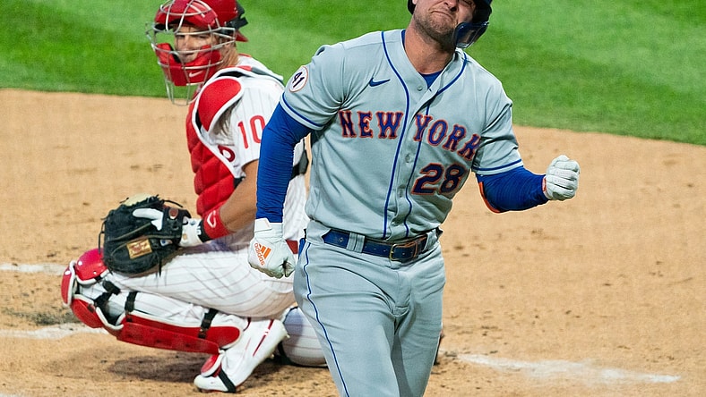 Apr 6, 2021; Philadelphia, Pennsylvania, USA; New York Mets left fielder J.D. Davis (28) reacts in front of Philadelphia Phillies catcher J.T. Realmuto (10) after being hit by a pitch during the first inning at Citizens Bank Park. Mandatory Credit: Bill Streicher-USA TODAY Sports