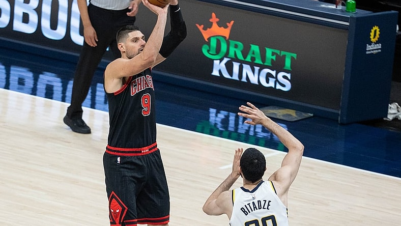 Apr 6, 2021; Indianapolis, Indiana, USA; Chicago Bulls center Nikola Vucevic (9) shoots the ball while Indiana Pacers center Goga Bitadze (88) defends in the third quarter at Bankers Life Fieldhouse. Mandatory Credit: Trevor Ruszkowski-USA TODAY Sports