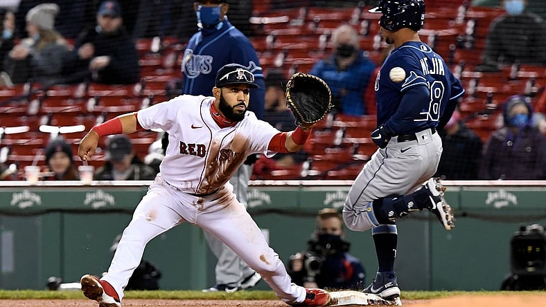 Apr 6, 2021; Boston, Massachusetts, USA; Tampa Bay Rays catcher Francisco Mejia (28) is safe at first base in front of Boston Red Sox first baseman Marwin Gonzalez (12) during the fourth inning at Fenway Park. Mandatory Credit: Brian Fluharty-USA TODAY Sports
