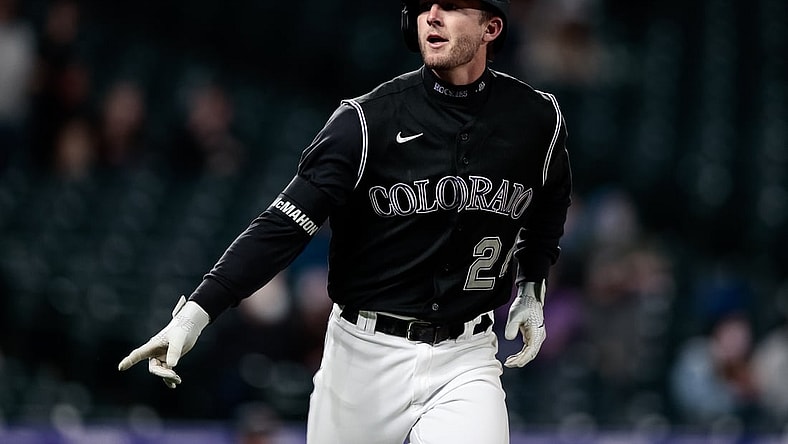 Apr 6, 2021; Denver, Colorado, USA; Colorado Rockies third baseman Ryan McMahon (24) gestures as he rounds the bases on a solo home run in the second inning against the Arizona Diamondbacks at Coors Field. Mandatory Credit: Isaiah J. Downing-USA TODAY Sports