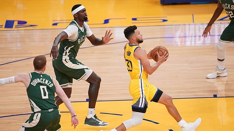 Apr 6, 2021; San Francisco, California, USA; Golden State Warriors guard Stephen Curry (30) drives to the hoop against the Milwaukee Bucks in the first quarter at the Chase Center. Mandatory Credit: Cary Edmondson-USA TODAY Sports