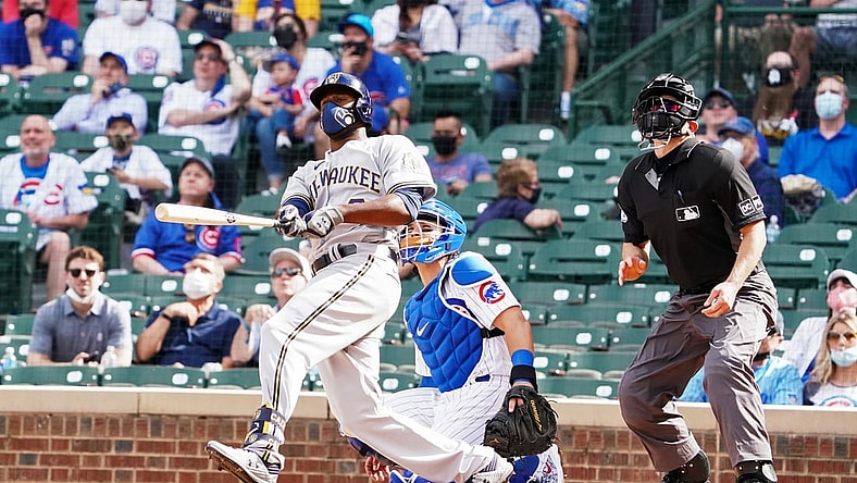 Apr 7, 2021; Chicago, Illinois, USA; Milwaukee Brewers center fielder Lorenzo Cain (6) hits a home run against the Chicago Cubs during the eighth inning at Wrigley Field. Mandatory Credit: David Banks-USA TODAY Sports
