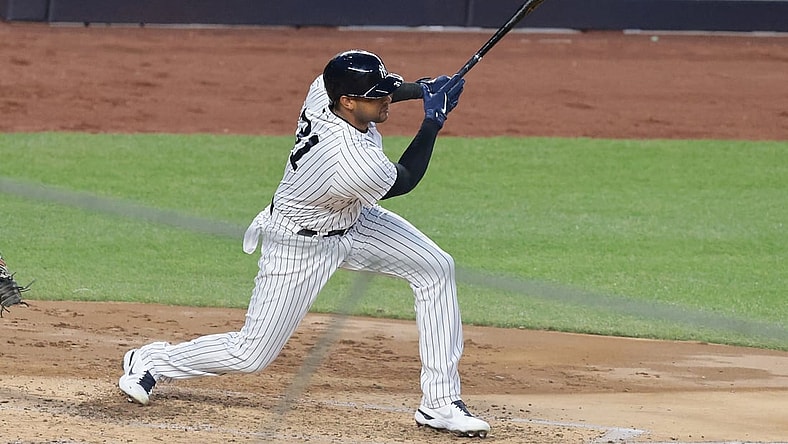 Apr 7, 2021; Bronx, New York, USA; New York Yankees center fielder Aaron Hicks (31) hits an RBI single during the third inning against the Baltimore Orioles at Yankee Stadium. Mandatory Credit: Vincent Carchietta-USA TODAY Sports