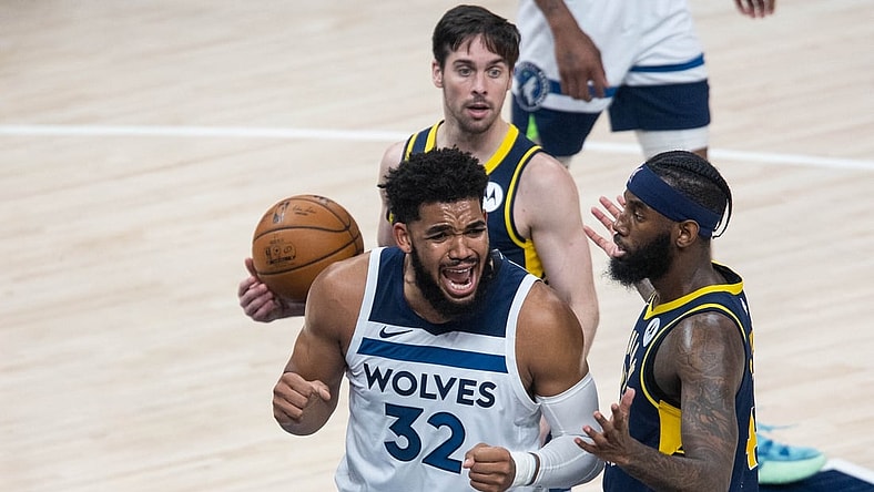 Apr 7, 2021; Indianapolis, Indiana, USA; Minnesota Timberwolves center Karl-Anthony Towns (32) reacts to a foul in the third quarter against the Indiana Pacers at Bankers Life Fieldhouse. Mandatory Credit: Trevor Ruszkowski-USA TODAY Sports