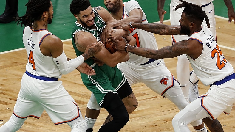 Apr 7, 2021; Boston, Massachusetts, USA; Boston Celtics forward Jayson Tatum (0) battles for the ball with New York Knicks guard Derrick Rose (4), center Taj Gibson (67) and New York Knicks forward Reggie Bullock (25) during the second quarter at TD Garden. Mandatory Credit: Winslow Townson-USA TODAY Sports