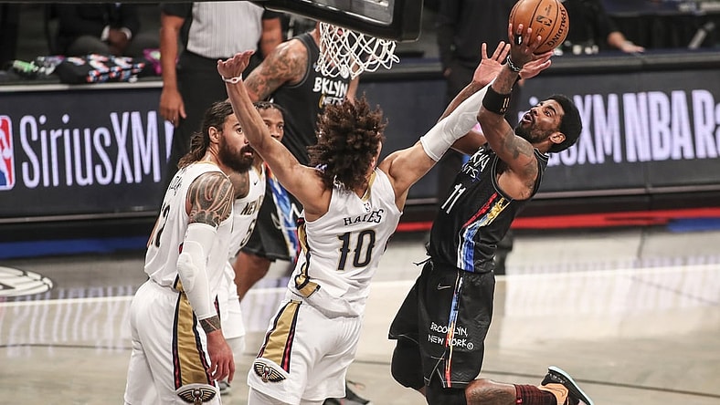 Apr 7, 2021; Brooklyn, New York, USA;  Brooklyn Nets guard Kyrie Irving (11) goes in for a layup in the second quarter against the New Orleans Pelicans at Barclays Center. Mandatory Credit: Wendell Cruz-USA TODAY Sports