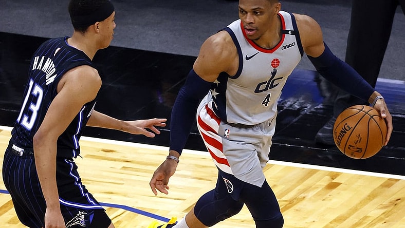 Apr 7, 2021; Orlando, Florida, USA; Washington Wizards guard Russell Westbrook (4) drives to the basket as Orlando Magic guard R.J. Hampton (13) defends during the second half at Amway Center. Mandatory Credit: Kim Klement-USA TODAY Sports