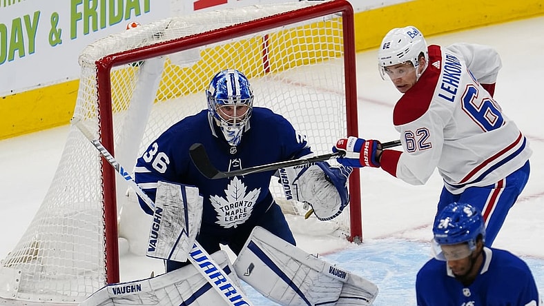 Apr 7, 2021; Toronto, Ontario, CAN; Montreal Canadiens forward Artturi Lehkonen (62) tries to deflect a shot against Toronto Maple Leafs goaltender Jack Campbell (36) during the second period at Scotiabank Arena. Mandatory Credit: John E. Sokolowski-USA TODAY Sports