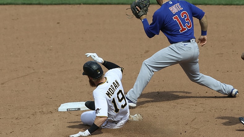 Apr 8, 2021; Pittsburgh, Pennsylvania, USA; Pittsburgh Pirates third baseman Colin Moran (19) slides into second base with a double as Chicago Cubs second baseman David Bote (13) takes a throw during the fifth inning at PNC Park. Mandatory Credit: Charles LeClaire-USA TODAY Sports