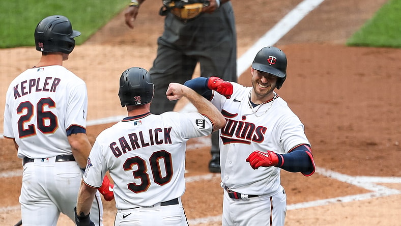 Apr 8, 2021; Minneapolis, Minnesota, USA; Minnesota Twins left fielder Kyle Garlick (30) celebrates with catcher Mitch Garver (8) after Garver hit a three-run home run in the third inning against the Seattle Mariners at Target Field. Mandatory Credit: David Berding-USA TODAY Sports