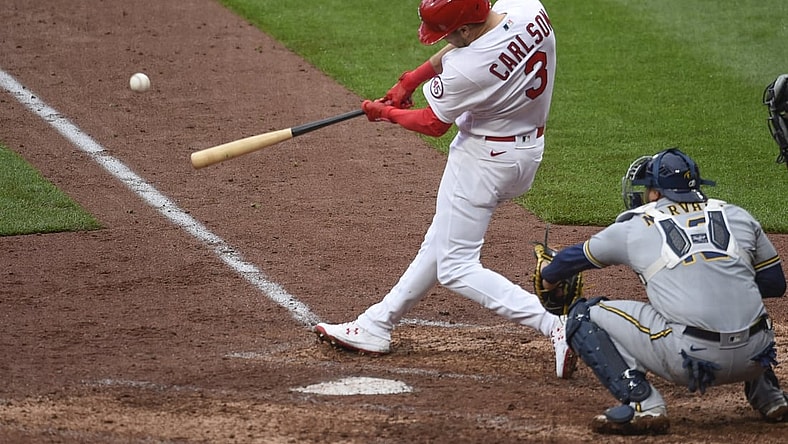 Apr 8, 2021; St. Louis, Missouri, USA; St. Louis Cardinals center fielder Dylan Carlson (3) hits a double against the Milwaukee Brewers in the seventh inning at Busch Stadium. Mandatory Credit: Joe Puetz-USA TODAY Sports