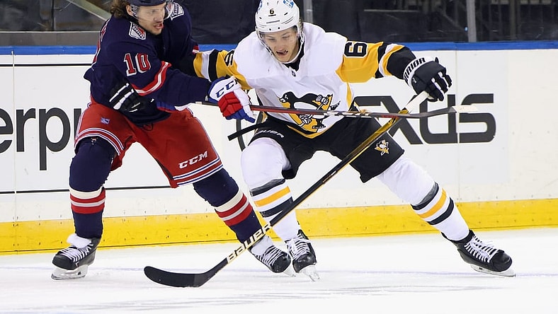 Apr 8, 2021; New York, New York, USA; Pittsburgh Penguins defenseman John Marino (6) plays for the puck against New York Rangers left wing Artemi Panarin (10) during the first period at Madison Square Garden. Mandatory Credit: Bruce Bennett/Pool Photo-USA TODAY Sports