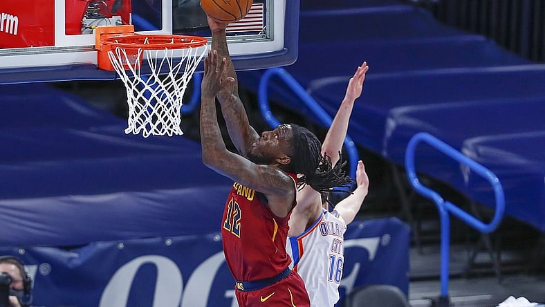 Apr 8, 2021; Oklahoma City, Oklahoma, USA; Cleveland Cavaliers forward Taurean Prince (12) goes to the basket ahead of Oklahoma City Thunder guard Ty Jerome (16) during the first quarter at Chesapeake Energy Arena. Mandatory Credit: Alonzo Adams-USA TODAY Sports
