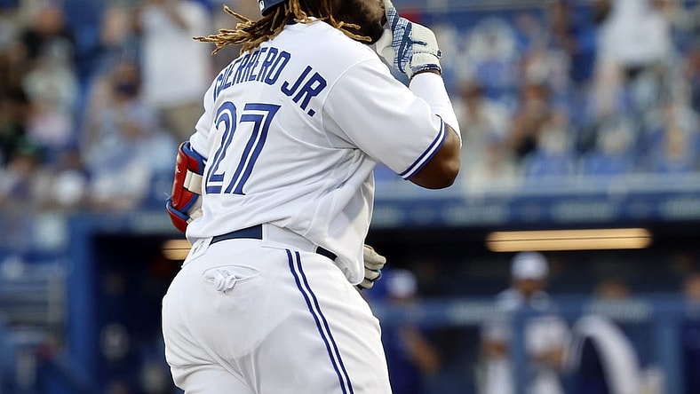 Apr 8, 2021; Dunedin, Florida, CAN; Toronto Blue Jays designated hitter Vladimir Guerrero Jr. (27) gestures as he runs the bases after hitting a two-run home run during the first inning against the Los Angeles Angels at TD Ballpark. Mandatory Credit: Kim Klement-USA TODAY Sports