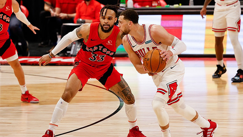 Apr 8, 2021; Tampa, Florida, USA; Chicago Bulls guard Zach LaVine (8) controls the ball against Toronto Raptors guard Gary Trent Jr. (33) during the second quarter at Amalie Arena. Mandatory Credit: Nathan Ray Seebeck-USA TODAY Sports