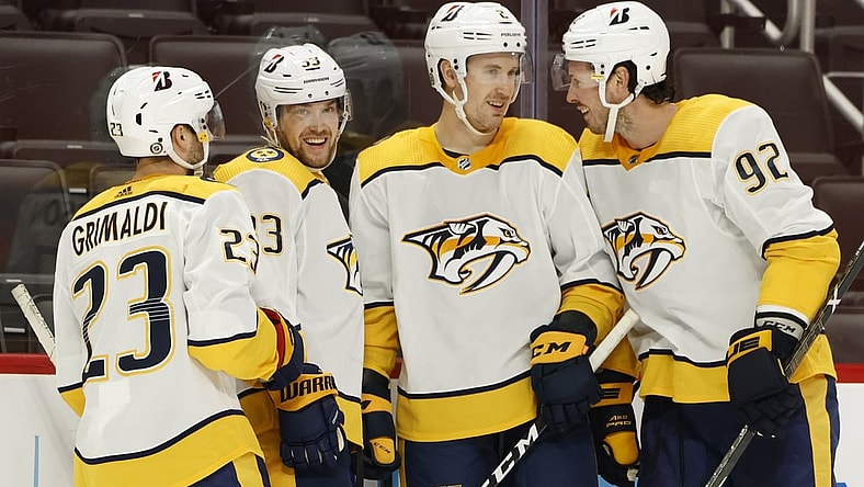 Apr 8, 2021; Detroit, Michigan, USA;  Nashville Predators right wing Viktor Arvidsson (33) is congratulated by teammates after scoring in the third period against the Detroit Red Wings at Little Caesars Arena. Mandatory Credit: Rick Osentoski-USA TODAY Sports