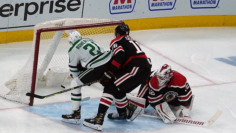 Apr 8, 2021; Chicago, Illinois, USA; Dallas Stars left wing Jason Robertson (21) scores a goal on Chicago Blackhawks goaltender Kevin Lankinen (32) during the second period at United Center. Mandatory Credit: David Banks-USA TODAY Sports