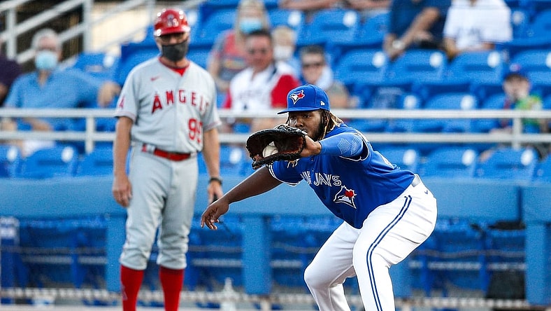 Apr 9, 2021; Dunedin, Florida, CAN; Toronto Blue Jays first baseman Vladimir Guerrero Jr. (27) catches a ball for an out at first base in a game against the Los Angeles Angels at TD Ballpark. Mandatory Credit: Nathan Ray Seebeck-USA TODAY Sports