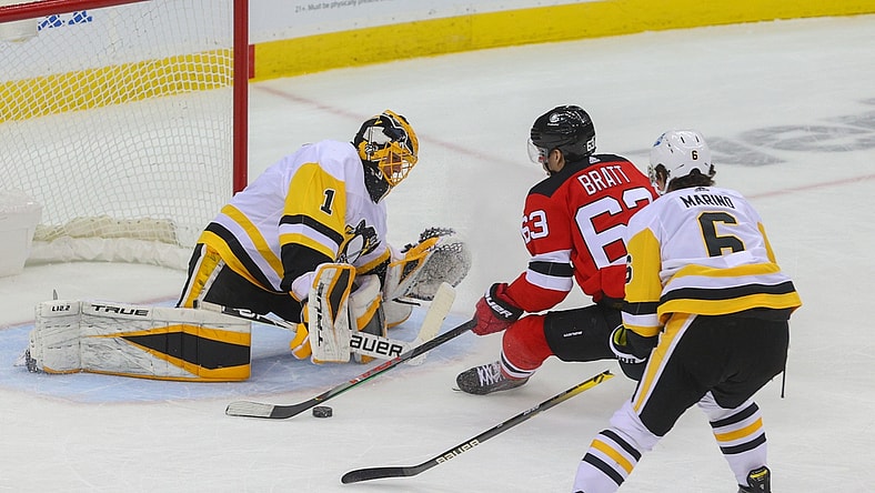 Apr 9, 2021; Newark, New Jersey, USA; New Jersey Devils left wing Jesper Bratt (63) skates with the puck towards the goal of Pittsburgh Penguins goaltender Casey DeSmith (1) during the first period at Prudential Center. Mandatory Credit: Ed Mulholland-USA TODAY Sports