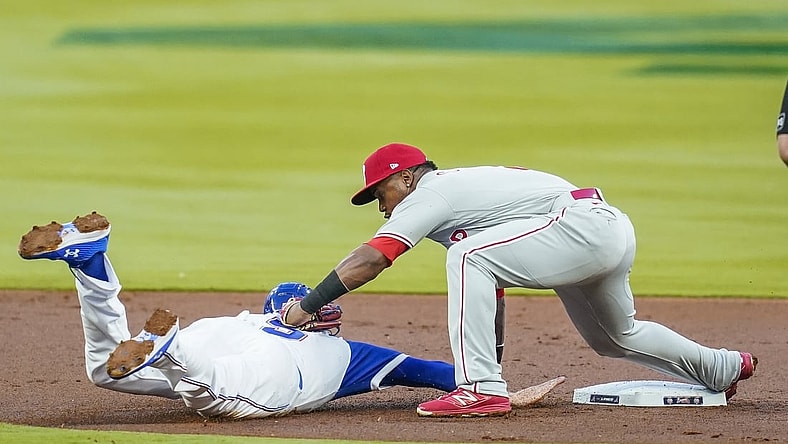 Apr 9, 2021; Cumberland, Georgia, USA; Atlanta Braves first baseman Freddie Freeman (5) is picked off of second base tagged out by Philadelphia Phillies shortstop Jean Segura (2) during the first inning at Truist Park. Mandatory Credit: Dale Zanine-USA TODAY Sports