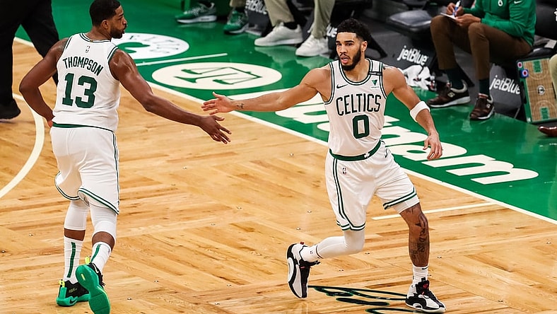 Apr 9, 2021; Boston, Massachusetts, USA; Boston Celtics forward Jayson Tatum (0) reacts after making a shot during the second half against the Minnesota Timberwolves at TD Garden. Mandatory Credit: Paul Rutherford-USA TODAY Sports