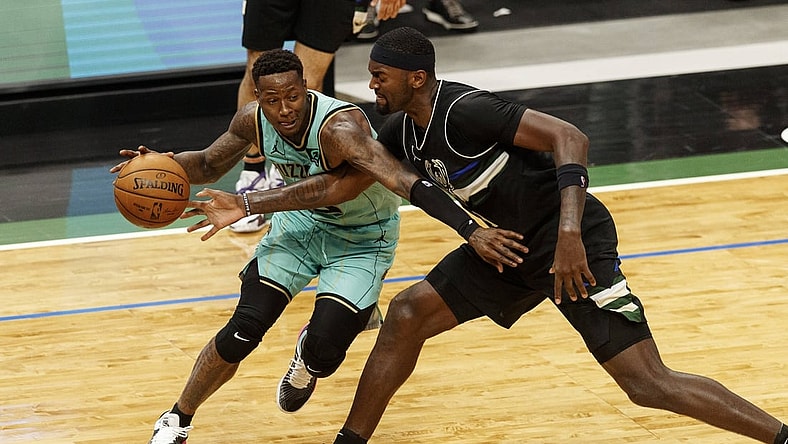 Apr 9, 2021; Milwaukee, Wisconsin, USA; Milwaukee Bucks forward Bobby Portis (9) reaches for the ball controlled by Charlotte Hornets guard Terry Rozier (3)  during the third quarter at Fiserv Forum. Mandatory Credit: Jeff Hanisch-USA TODAY Sports