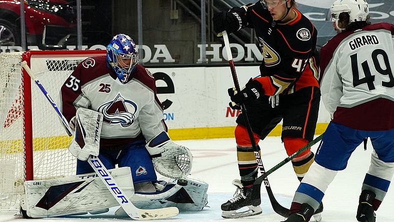 Apr 9, 2021; Anaheim, California, USA; Colorado Avalanche goaltender Jonas Johansson (35) blocks a shot as defenseman Samuel Girard (49) moves in to help defend against Anaheim Ducks center Danton Heinen (43) during the second period at Honda Center. Mandatory Credit: Gary A. Vasquez-USA TODAY Sports