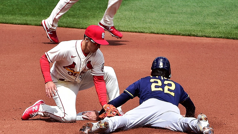 Apr 10, 2021; St. Louis, Missouri, USA; St. Louis Cardinals second baseman Tommy Edman (19) is unable to tag out Milwaukee Brewers left fielder Christian Yelich (22) as he steals second during the first inning at Busch Stadium. Mandatory Credit: Jeff Curry-USA TODAY Sports