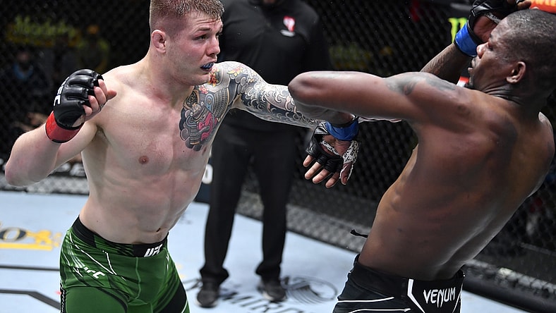 April 10, 2021; Las Vegas, NV, USA;   Marvin Vettori of Italy punches Kevin Holland in a middleweight fight during the UFC Fight Night event at UFC APEX on April 10, 2021 in Las Vegas, Nevada. Mandatory Credit: Chris Unger/Handout Photo via USA TODAY Sports