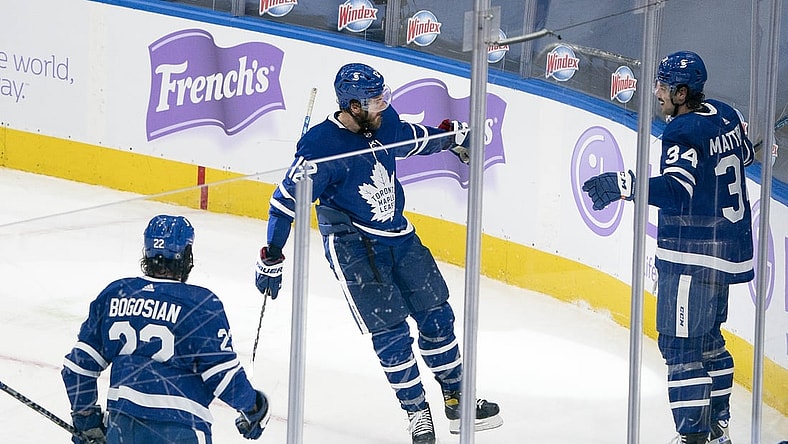 Apr 10, 2021; Toronto, Ontario, CAN; Toronto Maple Leafs center Auston Matthews (34) celebrates with center Alex Galchenyuk (12) after scoring a third goal against the Ottawa Senators during the second period at Scotiabank Arena. Mandatory Credit: Nick Turchiaro-USA TODAY Sports