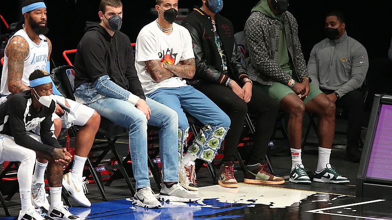Apr 10, 2021; Brooklyn, New York, USA; Los Angeles Lakers center Marc Gasol (14) and small forward Kyle Kuzma (0) and power forward Anthony Davis (3) and small forward LeBron James (23) watch from the bench during the first quarter against the Brooklyn Nets at Barclays Center. Mandatory Credit: Brad Penner-USA TODAY Sports