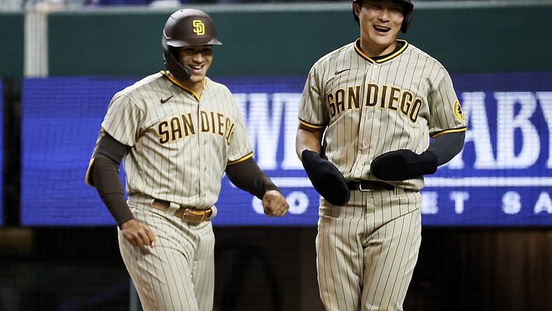 Apr 10, 2021; Arlington, Texas, USA;  San Diego Padres center fielder Trent Grisham (left) celebrates with shortstop Ha-Seong Kim (7) after hitting a home run during the seventh inning against the Texas Rangers at Globe Life Field. Mandatory Credit: Kevin Jairaj-USA TODAY Sports