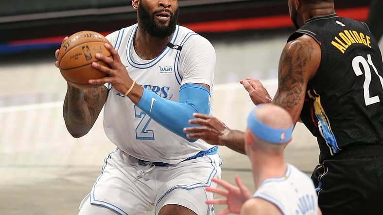 Apr 10, 2021; Brooklyn, New York, USA; Los Angeles Lakers center Andre Drummond (2) drives to the basket against Brooklyn Nets center LaMarcus Aldridge (21) during the third quarter at Barclays Center. Mandatory Credit: Brad Penner-USA TODAY Sports